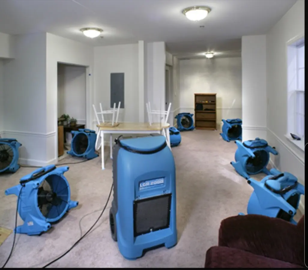Air movers and dehumidifier setup for Water Damage Restoration in Larose